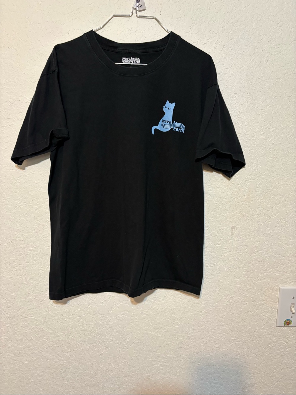 Wave To Earth 0.03 NA Black Short-Sleeve Tee with Blue Cat Logo